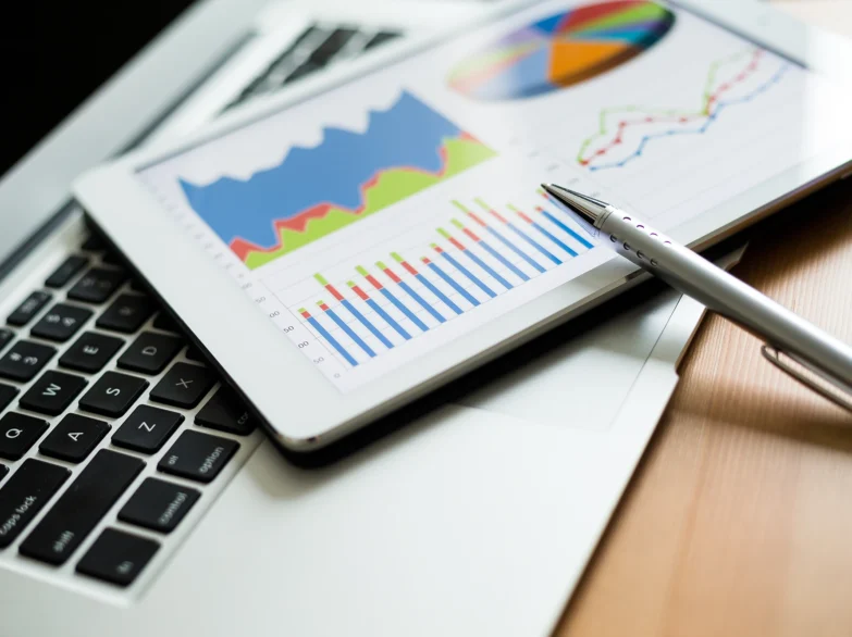 Image showing a tablet being used for business tasks, including reporting and analytics.